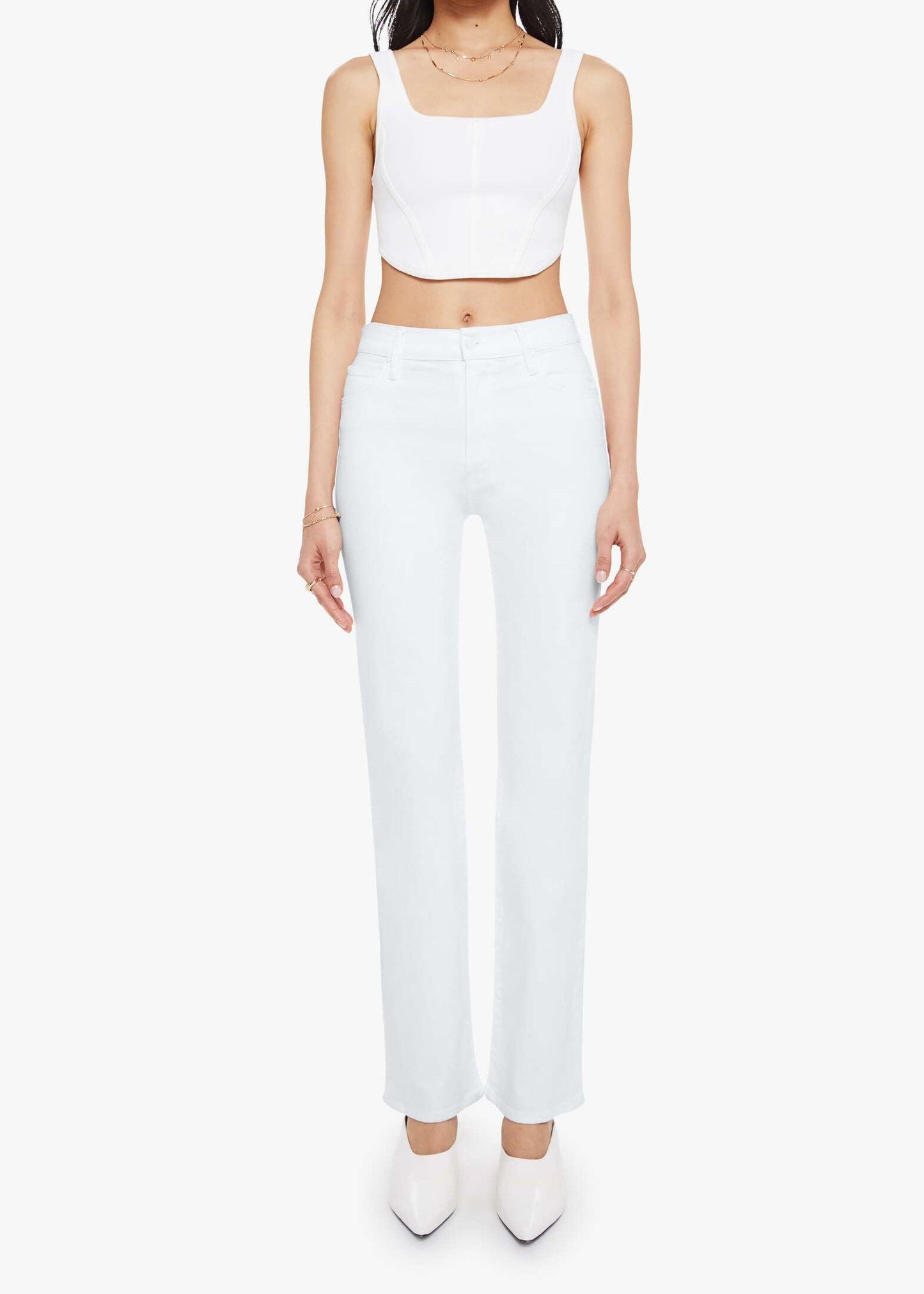 Person wearing a white sleeveless top and pants on a white background