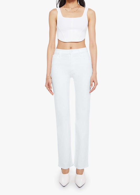 Person wearing a white sleeveless top and pants on a white background