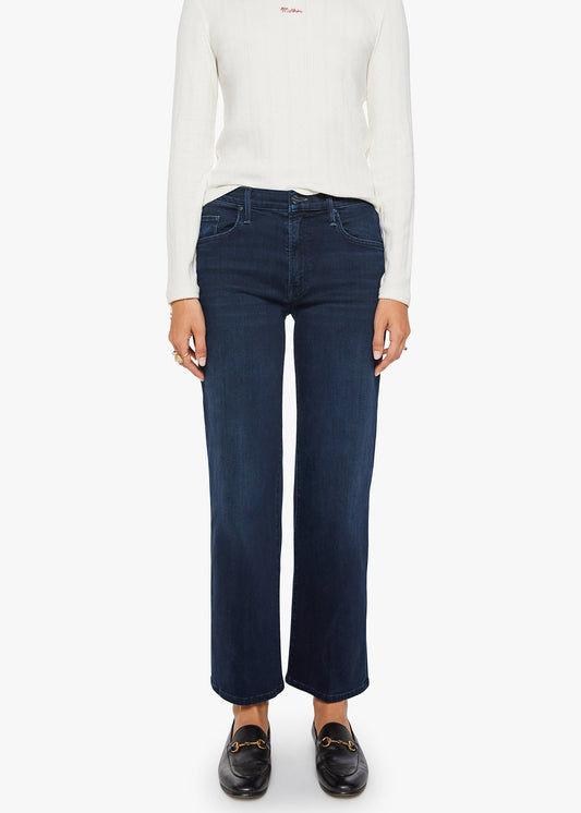 Person wearing a white long-sleeve shirt and dark blue jeans on a white background