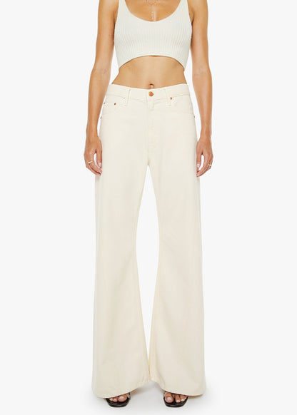 Person wearing a white tank top and wide-leg pants on a white background
