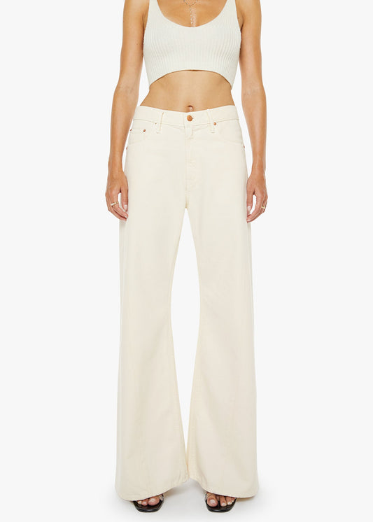 Person wearing a white tank top and wide-leg pants on a white background