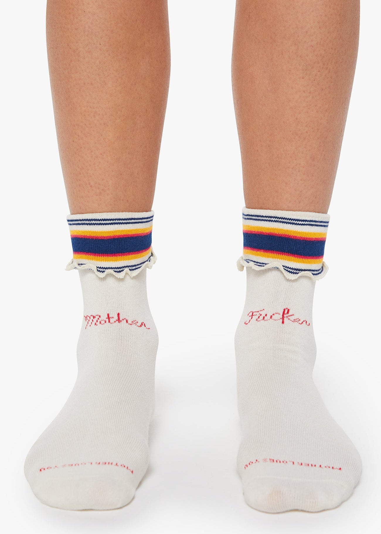 White socks with colorful stripes and text on a white background