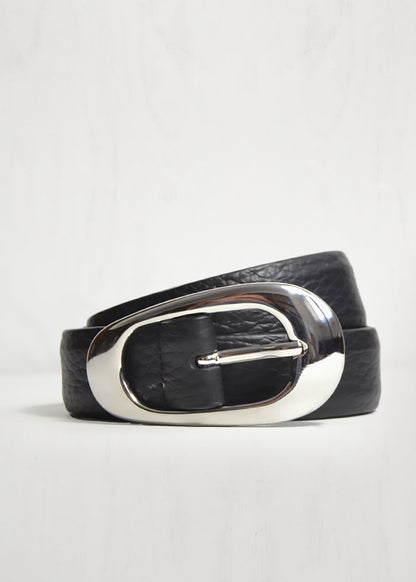 Black leather belt with a silver buckle on a light gray background
