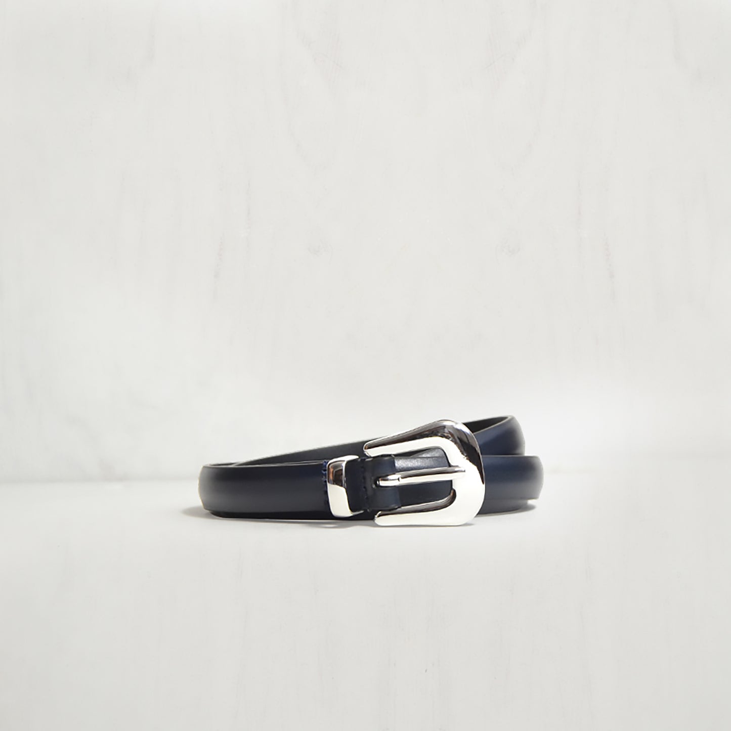 NAVY THIN BELT W POLISHED MODERN WESTERN BUCKLE