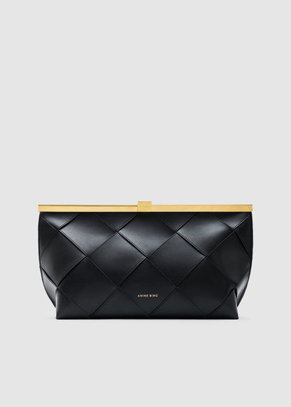 A black quilted leather clutch bag with a gold metal frame and a small gold logo on the front, set against a solid light gray background.