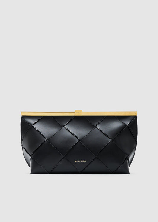 A black quilted leather clutch bag with a gold metal frame and a small gold logo on the front, set against a solid light gray background.
