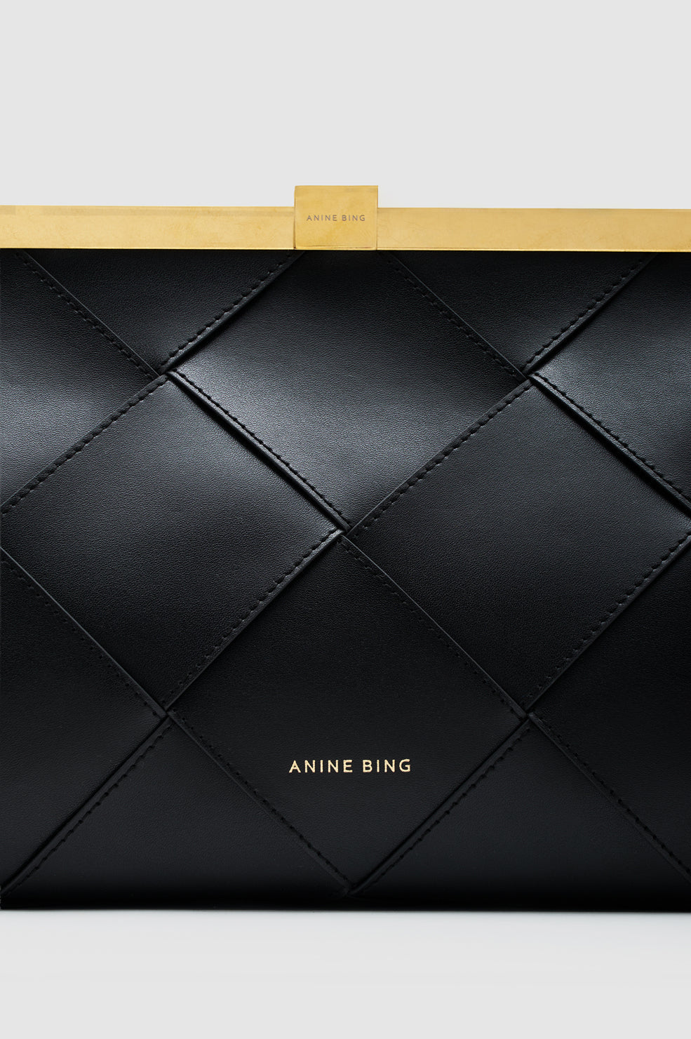 ANINE CLUTCH BRAIDED LEATHER IN BLACK