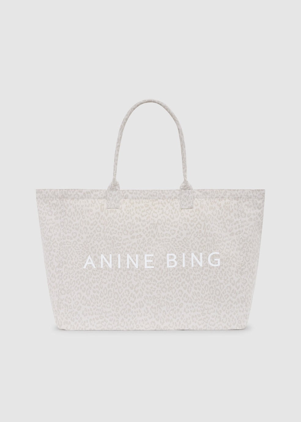 Light gray tote bag with 'ANINE BING' branding on a white background