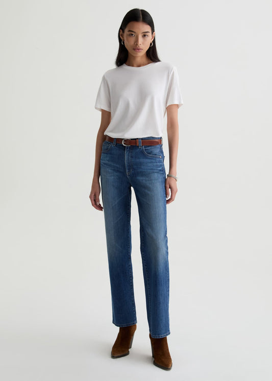 Person wearing a white t-shirt and blue jeans on a white background