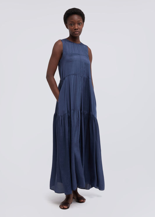 Woman wearing a blue dress on a white background