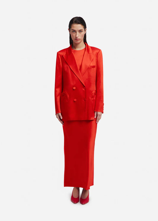 Woman wearing a red suit on a white background