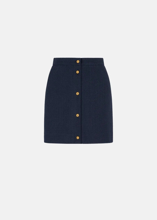 Navy blue skirt with gold buttons on a white background