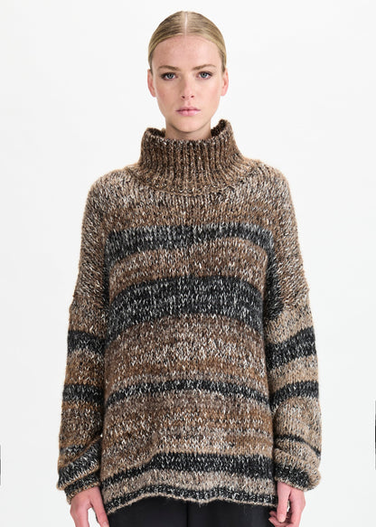 Person wearing a striped sweater on a white background