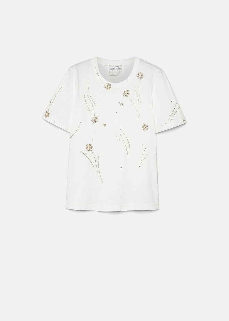 White blouse with floral embroidery on a white background