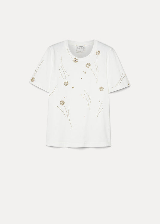 White blouse with floral embroidery on a white background