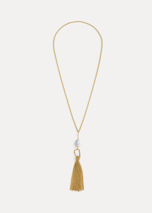 Gold necklace with a tassel pendant on a white background