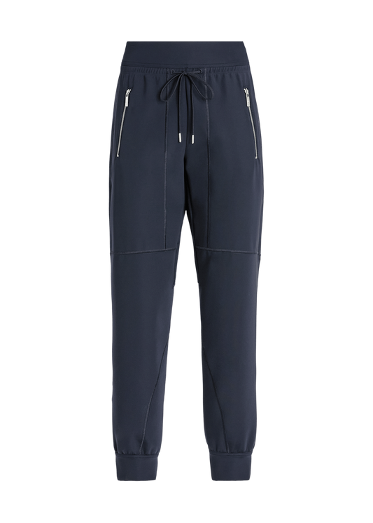 A pair of dark navy blue jogger-style pants with zippered side pockets, a drawstring waist, and elastic cuffs, shown against a plain white background.