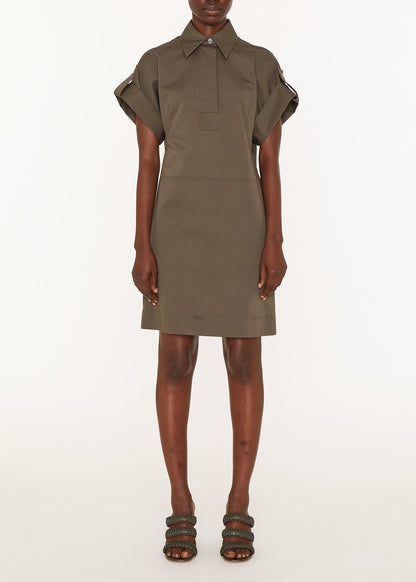 Person wearing a green dress on a white background