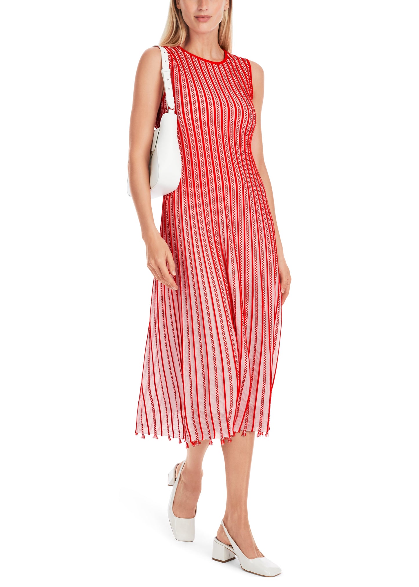 Woman wearing a red and white striped dress on a white background