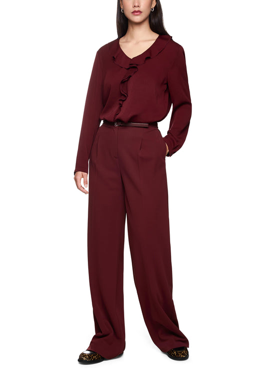 Maroon outfit with a top and pants on a white background