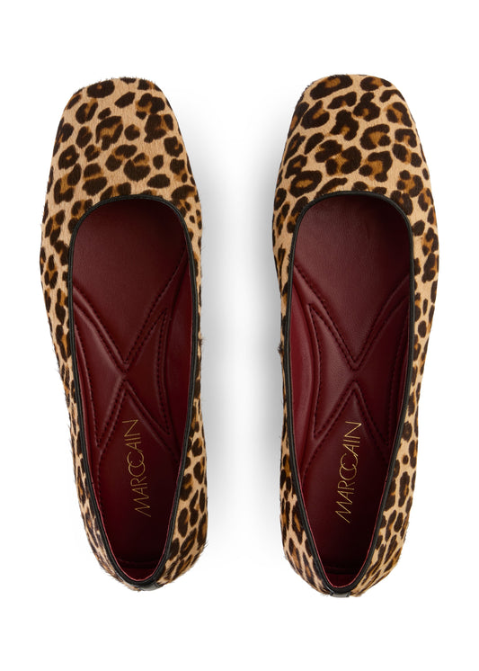 Leopard print flats with 'Marc by Marc Jacobs' branding on a white background