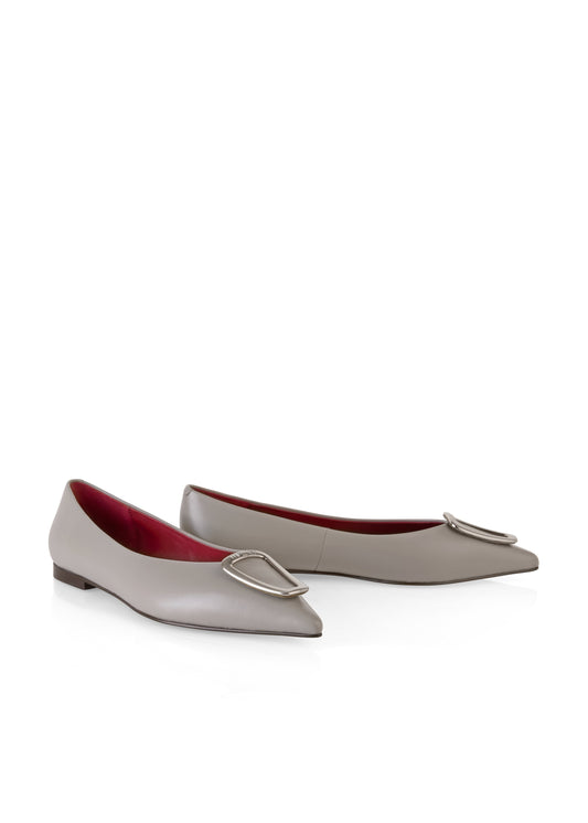 Pair of light gray flat shoes with a decorative buckle on a white background