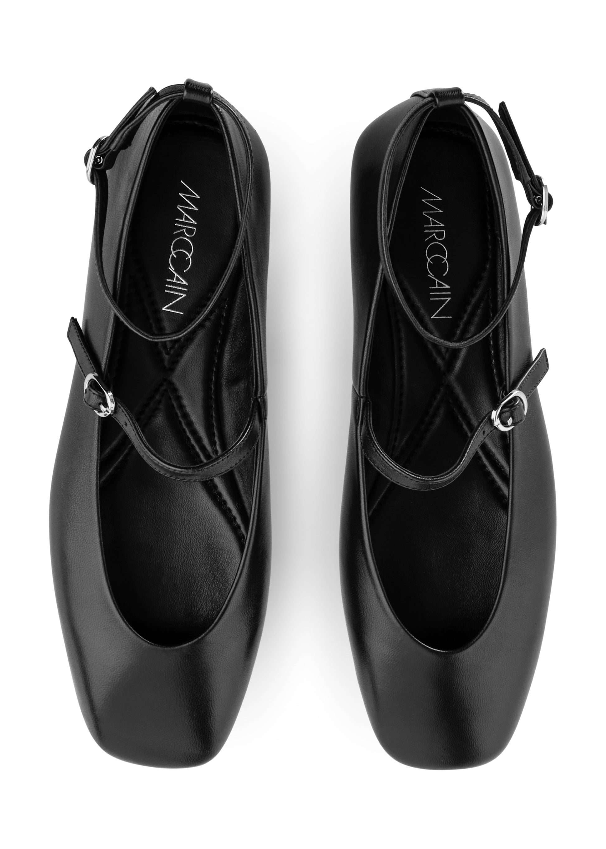 Black ballet shoes with 'Marc Cain' branding on a white background