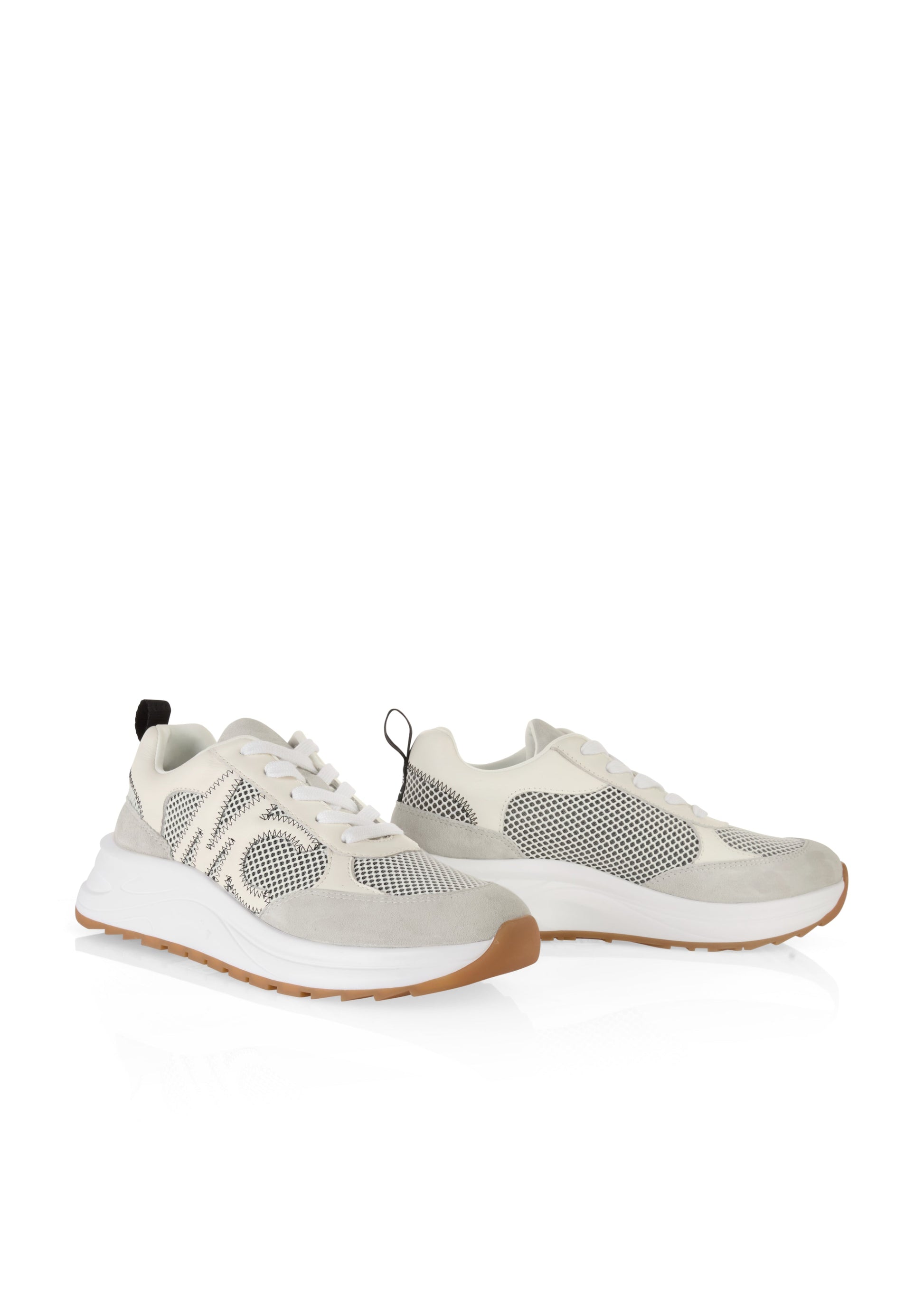 Pair of light gray sneakers with white soles on a white background