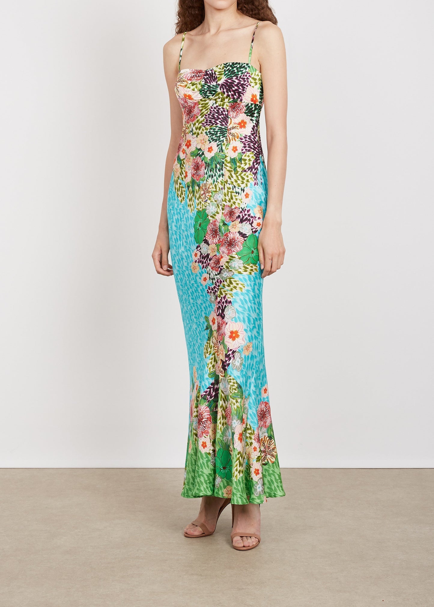 Woman wearing a floral dress with a white background