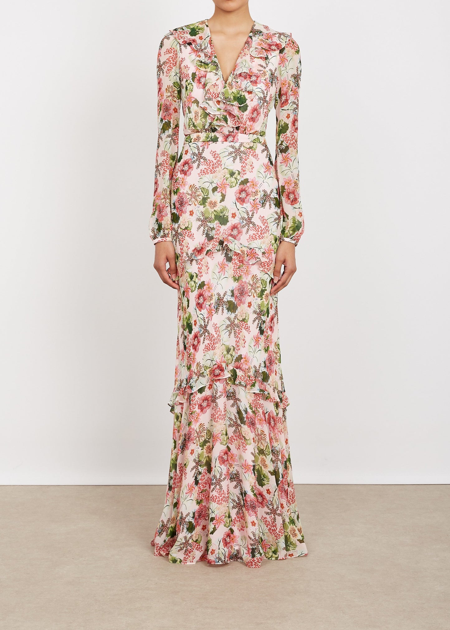 Floral dress with long sleeves on a plain background