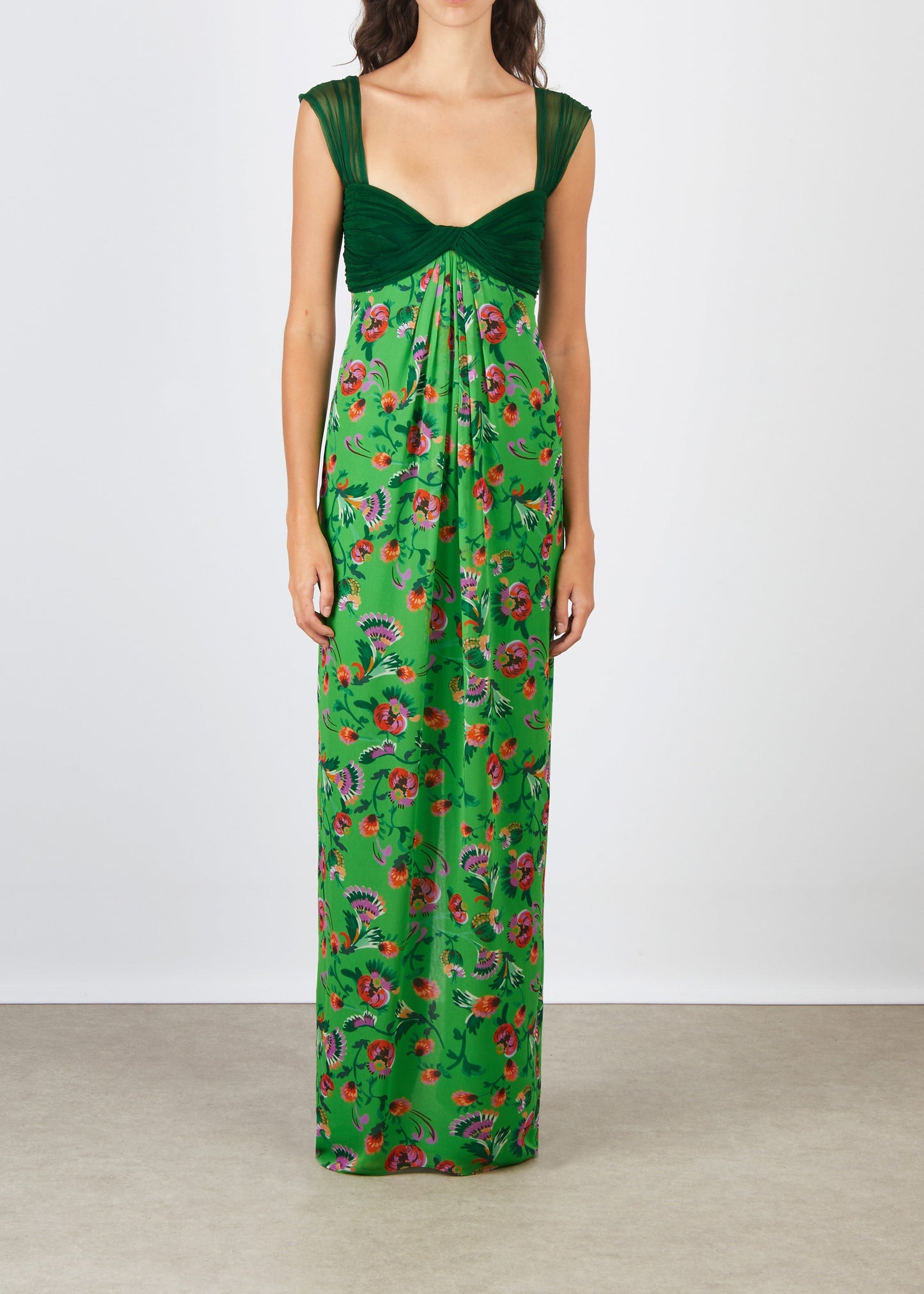 Green floral dress on a plain background