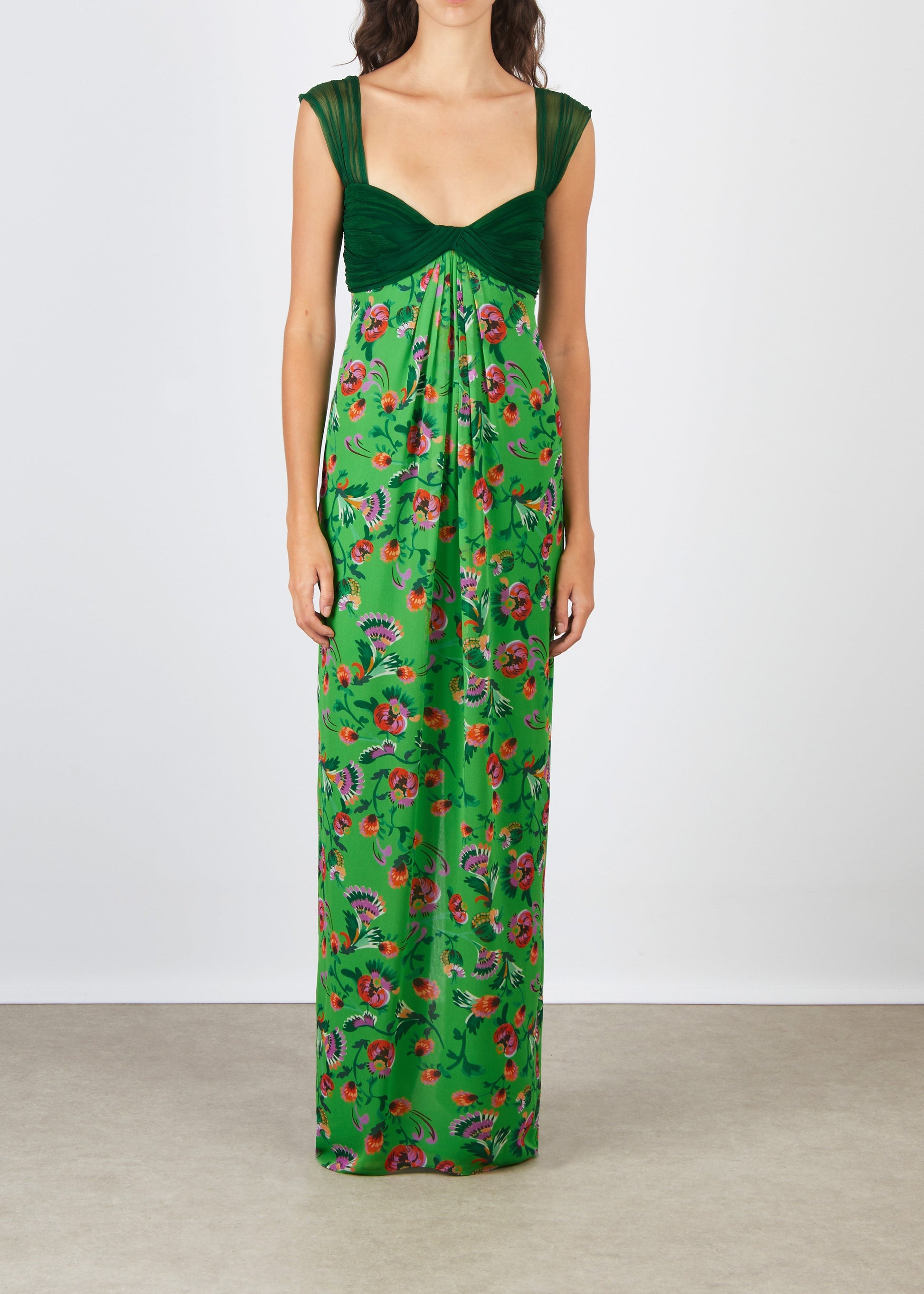 Green floral dress on a plain background
