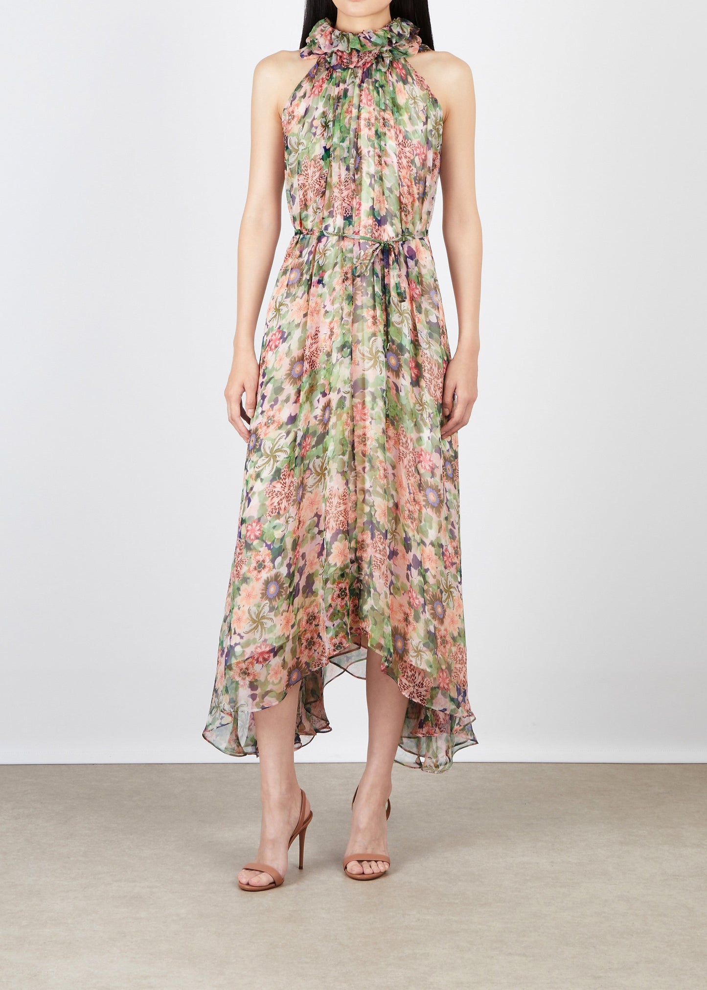 Floral dress worn by a model on a plain background