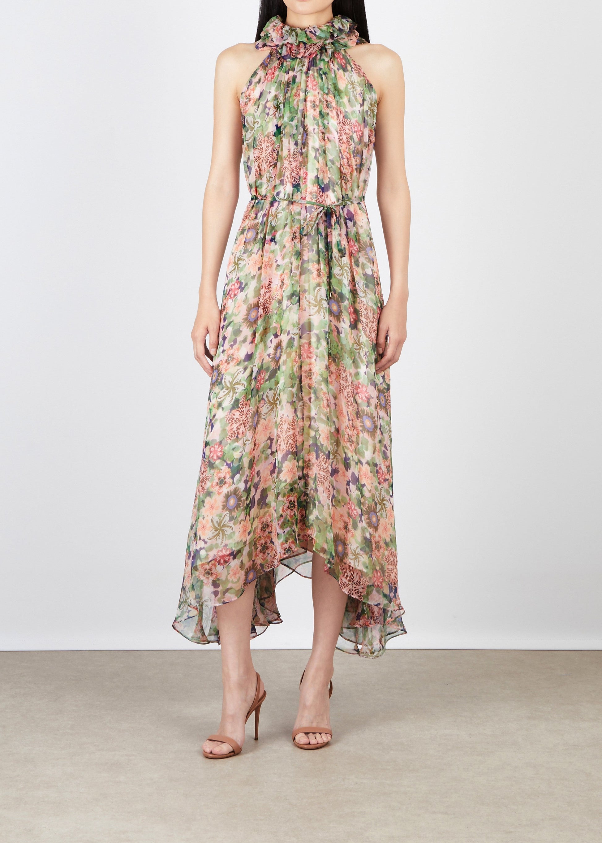 Floral dress worn by a model on a plain background