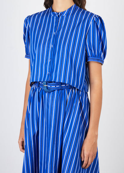 Blue and white striped dress with a belt on a plain background