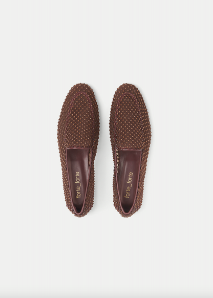 Pair of brown textured loafers on a white background
