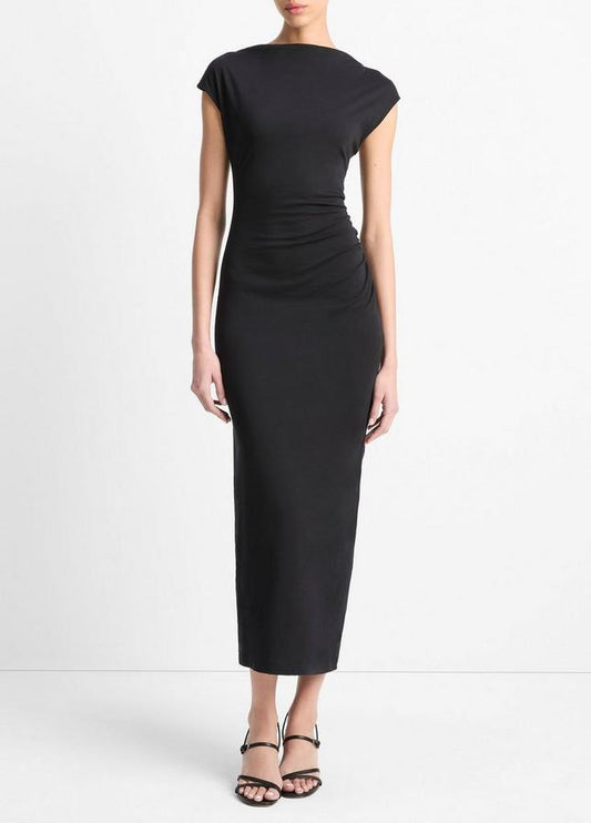 Black dress worn by a model on a white background
