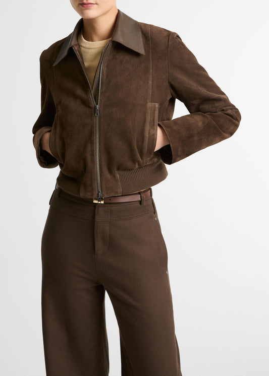 Brown suede jacket and pants worn by a person on a white background