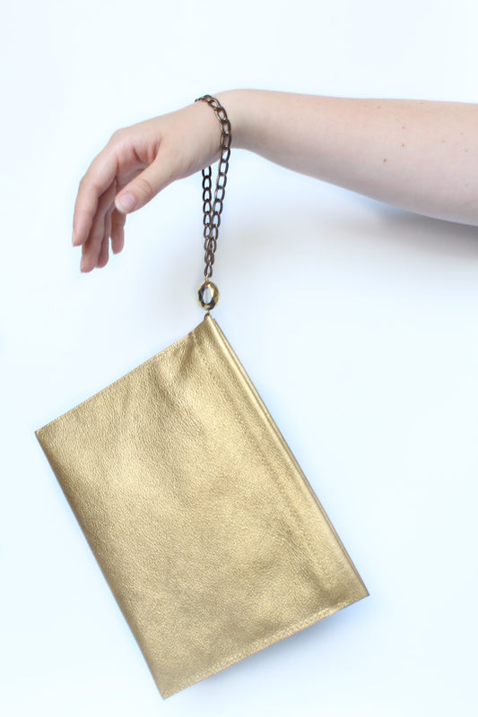 "THE CLUTCH" IN GOLD LEATHER