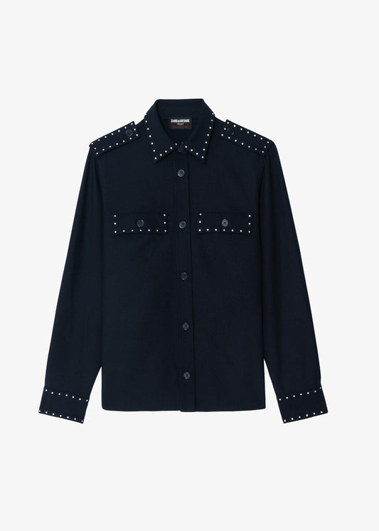 Black shirt with studded details on a white background
