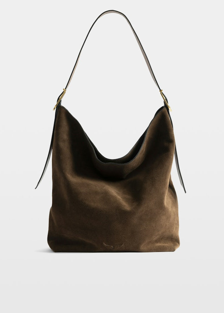 Brown leather handbag on a light gray background