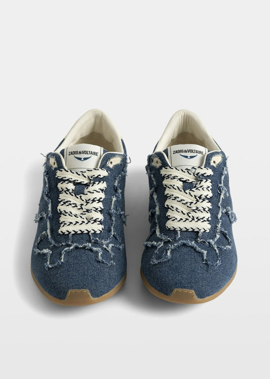 Pair of blue sneakers with white laces on a white background