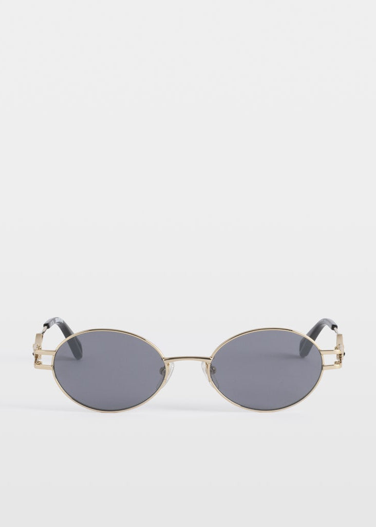 Small oval sunglasses with gold frame and dark lenses on a white background
