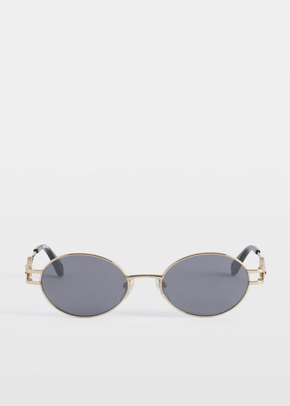 Small oval sunglasses with gold frame and dark lenses on a white background