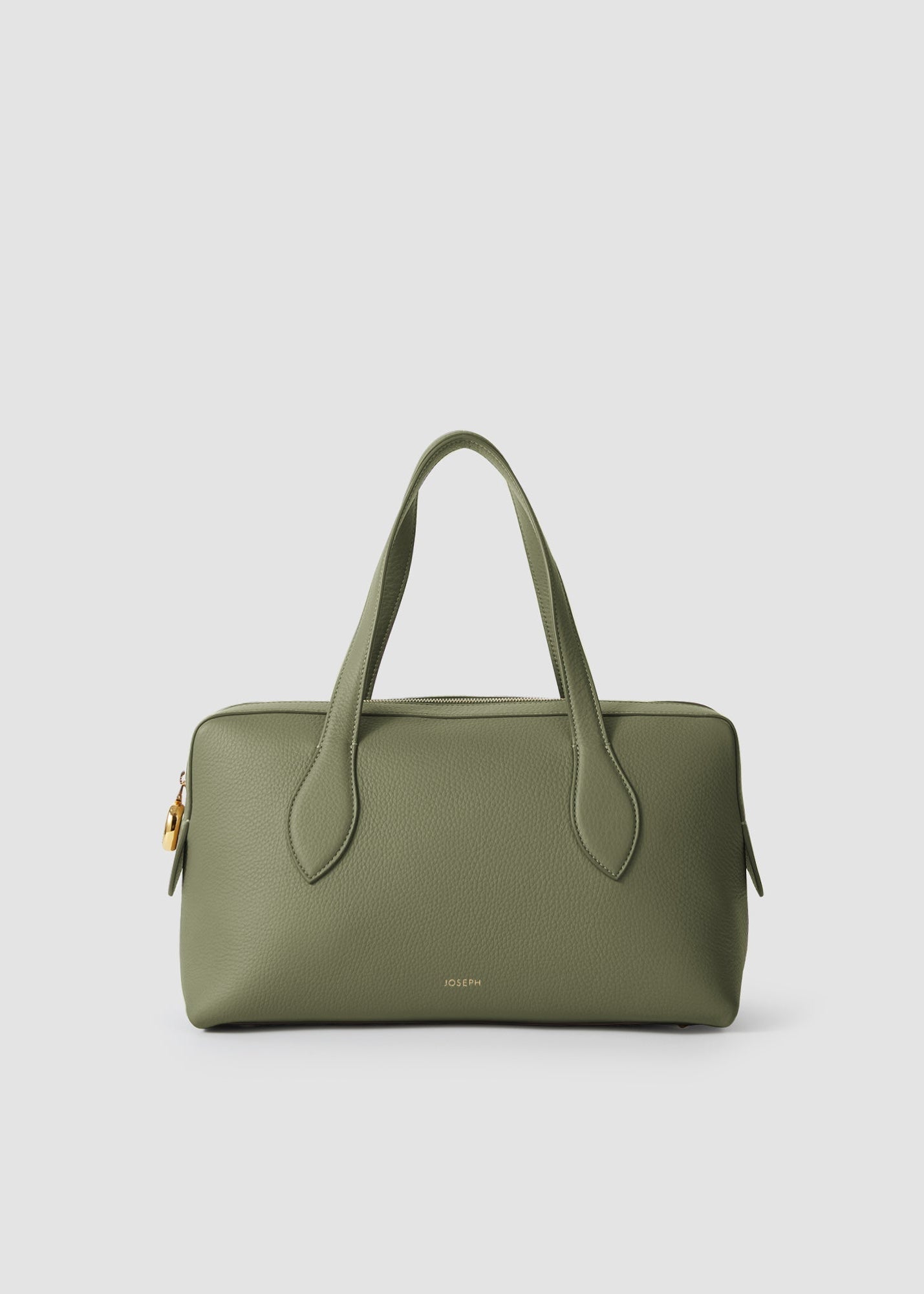 Green handbag on a light gray background