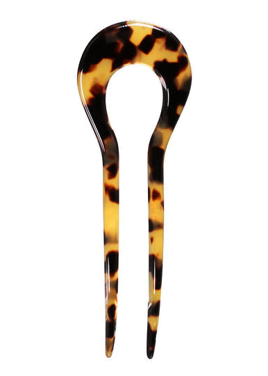 Tortoiseshell hair pin on a white background