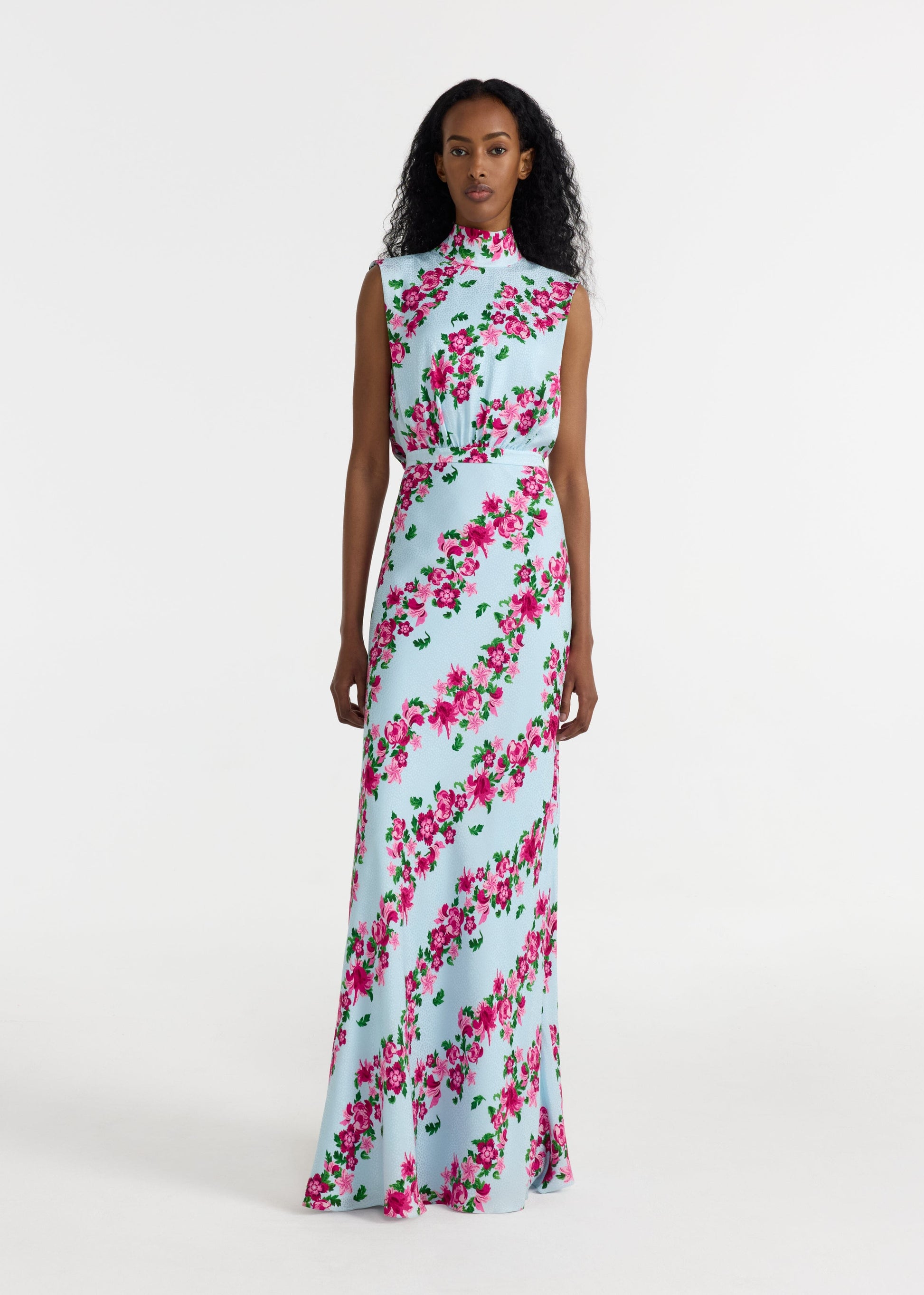 Woman wearing a floral dress on a white background