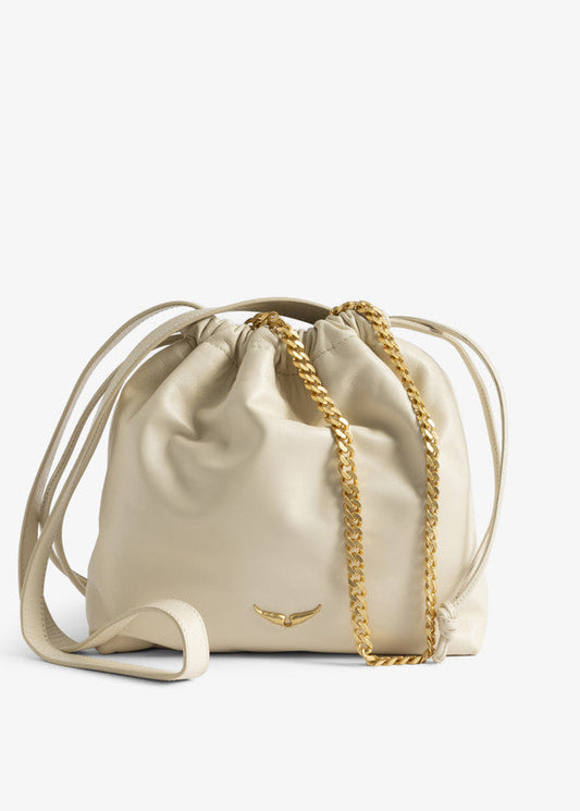 Beige drawstring bag with a gold chain on a white background